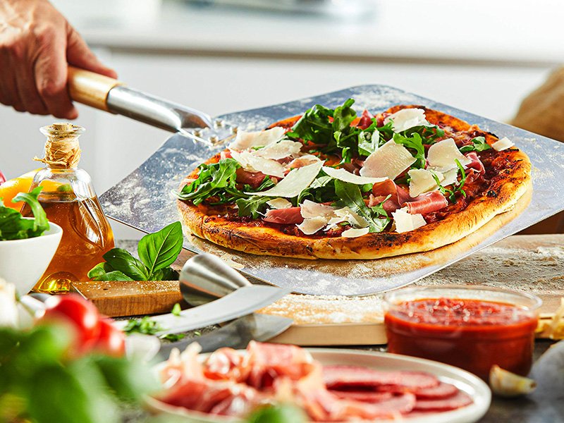 Pierre à pizza et sa pelle